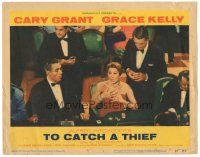 3y912 TO CATCH A THIEF LC #8 '55 Cary Grant behind woman at baccarat table, Alfred Hitchcock