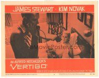 3y945 VERTIGO LC #5 '58 Alfred Hitchcock, standing James Stewart on phone,blonde Kim Novak in bed!
