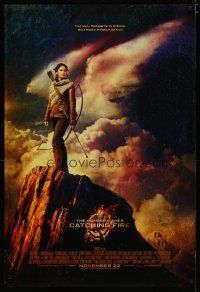 4s004 HUNGER GAMES: CATCHING FIRE advance DS 1sh '13 Jennifer Lawrence w/bow on mountain!