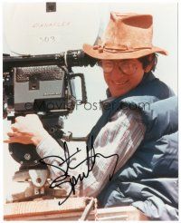 4t774 STEVEN SPIELBERG signed color 8x10 REPRO still '80s great close up by camera on movie set!