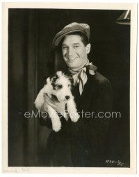 5k637 MAURICE CHEVALIER 8x10.25 still '29 smiling portrait holding dog from Innocents of Paris!