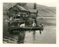 5k955 WALLACE BEERY 8x10.25 still '30s in boat with his dogs at his mountain cabin by Otto Dyar!