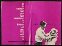 5s017 CARPETBAGGERS pressbook '64 great close up of Carroll Baker biting George Peppard's hand!