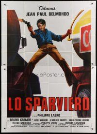 6a079 HUNTER WILL GET YOU Italian 2p '76 Jean-Paul Belmondo between two trucks by Averardo Ciriello!
