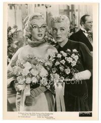 6c441 HOW TO MARRY A MILLIONAIRE 8.25x10 still '53 sexy Marilyn Monroe & Betty Grable w/ flowers!