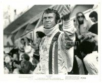 6c546 LE MANS 8x10.25 still '71 c/u of sweaty Steve McQueen in racing suit with his arm raised!