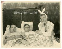 6c549 LEAVE 'EM LAUGHING 8x10.25 still '28 Stan Laurel with bunny ears in bed with Oliver Hardy!