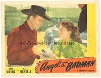 6h165 ANGEL & THE BADMAN LC #8 '47 c/u of pretty Gail Russell handing gun to cowboy John Wayne!