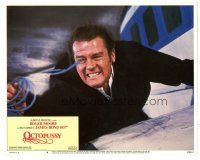 6h650 OCTOPUSSY LC #4 '83 intense c/u of Roger Moore as James Bond hanging from airplane wing!