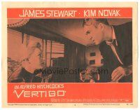 6h946 VERTIGO LC #8 '58 Alfred Hitchcock, standing James Stewart glares at blonde Kim Novak!