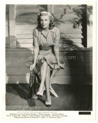 6t362 BAHAMA PASSAGE deluxe 8.25x10.25 still '41 Madeleine Carroll sitting on table showing legs!