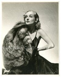 6t030 CAROLE LOMBARD 7.5x9.5 still '37 with black silk gown & holding fur coat from Nothing Sacred!