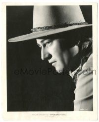 8h491 JOHN WAYNE 8.25x10 still '39 incredible profile c/u over black background from Stagecoach!