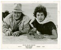 9a535 LEGEND OF THE LOST 8.25x10 still '57 John Wayne & Sophia Loren laying in desert sand!