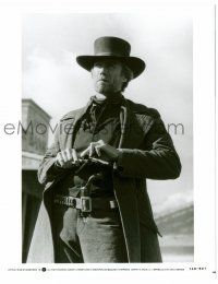 9a685 PALE RIDER 8x10 still '85 great close up of cowboy Clint Eastwood loading his gun!