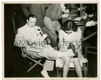 9a924 TRADE WINDS candid 8x10.25 still '38 Fredric March reads lines as wardrobe fixes his costume!
