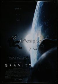 9b282 GRAVITY October advance DS 1sh '13 Sandra Bullock, George Clooney, adrift over earth!
