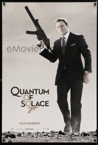 9b594 QUANTUM OF SOLACE teaser 1sh '08 Daniel Craig as Bond with H&K submachine gun!
