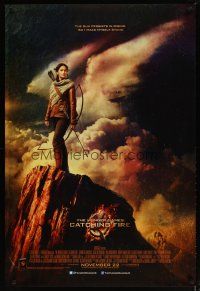 9k081 HUNGER GAMES: CATCHING FIRE advance English 1sh '13 Jennifer Lawrence w/bow on mountain!