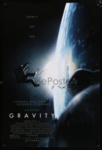 9m346 GRAVITY October advance DS 1sh '13 Sandra Bullock, George Clooney, adrift in space!