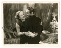 9y582 MOROCCO 8x10.25 still '30 Marlene Dietrich grabs book Adolphe Menjou has behind his back!