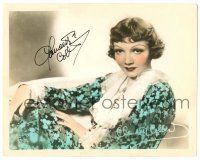 1a403 CLAUDETTE COLBERT signed color 8x10.25 still '30s seated portrait in pretty floral dress!