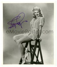 1a750 GINGER ROGERS signed 8x10 REPRO still '80s sexy seated c/u in short skirt showing her legs!