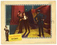 1r528 CITY LIGHTS LC #6 R50 Charlie Chaplin doffs his hat to policeman scowling at him, classic!