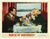 1r782 NORTH BY NORTHWEST LC #5 R66 Cary Grant lights Eva Marie Saint's cigarette while eating!