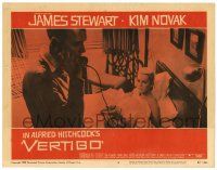 1r973 VERTIGO LC #5 '58 Alfred Hitchcock, James Stewart on phone, blonde Kim Novak in bed!