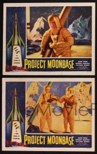 2x210 PROJECT MOONBASE 3 LCs '53 Robert Heinlein, border art of rocket ship + wacky astronauts!