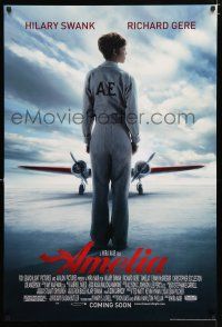 3b046 AMELIA advance DS 1sh '09 image of pilot Hilary Swank in title role w/her Lockheed Electra!