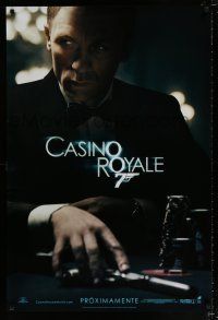 3b153 CASINO ROYALE Spanish/U.S. teaser DS 1sh '06 Craig as James Bond sitting at poker table w/gun!
