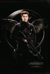 3h363 HUNGER GAMES: MOCKINGJAY - PART 1 teaser DS 1sh '14 image of Liam Hemsworth as Gale!