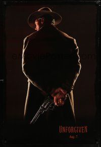 3h802 UNFORGIVEN dated teaser 1sh '92 classic image of gunslinger Clint Eastwood w/back turned!
