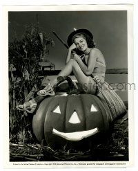 3y079 ANNE NAGEL 8x10 still '40 wearing streamlined witch costume over giant Halloween pumpkin!