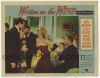 3z991 WRITTEN ON THE WIND LC #3 '56 Rock Hudson is amused by Dorothy Malone at party, Douglas Sirk