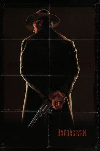 4f935 UNFORGIVEN undated teaser 1sh '92 image of gunslinger Clint Eastwood w/back turned!