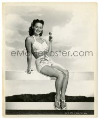 4m469 JANIS CARTER 8.25x10 still '53 sitting on a fence in sexy halter top holding sunglasses!