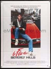 4y454 BEVERLY HILLS COP French 1p '84 great image of cop Eddie Murphy sitting on Mercedes!