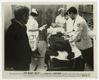 5d177 BULLITT 8.25x10 still '68 Steve McQueen watches doctors & nurses take care of wounded guy!