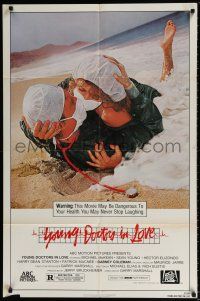 5f992 YOUNG DOCTORS IN LOVE 1sh '82 Michael McKean, Sean Young,doctors in scrubs making out on beach