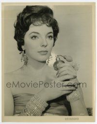 6a474 JOAN COLLINS 8x10.25 still '56 in low-cut elegant gown & perfume bottle from The Opposite Sex!