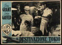 6j476 DESTINATION TOKYO Italian photobusta '43 Cary Grant & doctor looking over patient!