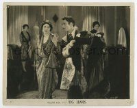 6x217 FIG LEAVES 8x10.25 still '26 Oliver Borden defies her husband and works in a dress shop!