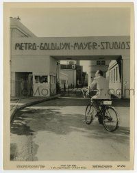 6x446 MAN ON FIRE candid 8x10.25 still '57 Bing Crosby riding his bicycle onto the MGM studio lot!