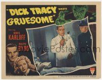 7j181 DICK TRACY MEETS GRUESOME LC #5 '47 cop watches Boris Karloff examine wounded man!