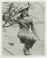 7m354 FAY MCKENZIE 8x10 still '30s as a sexy western cowgirl sitting on fence with lariat!