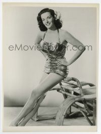 7m514 JANE RUSSELL 7.75x10.5 still '50s full-length in sexy swimsuit sitting on bamboo chair!