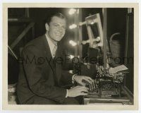 7m726 PRIVATE WORLDS candid 8x10.25 still '35 Joel McCrea takes time out to do some typing on set!